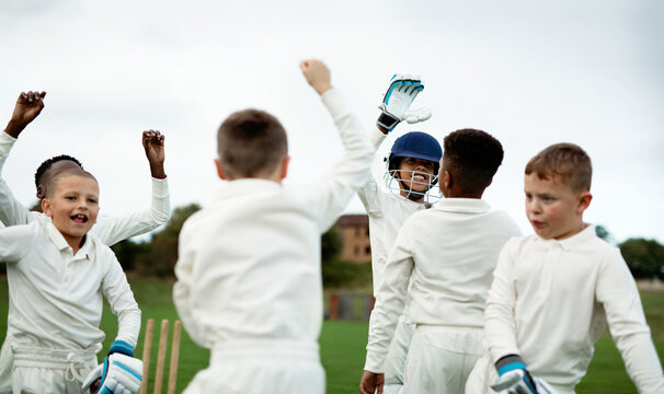Kids playing cricket